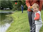 A man fishing with his son at COOPERSTOWN SHADOW BROOK CAMPGROUND - thumbnail