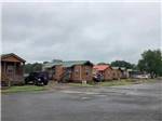 A row of rental cabins at MORRILTON I40/107 RV PARK - thumbnail