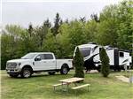 A truck and travel trailer at OAK HAVEN FAMILY CAMPGROUND - thumbnail