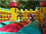 Kids playing in the bounce house at MEADOWBROOK CAMPING AREA - thumbnail