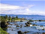 The pacific coast with rocks at VILLAGE CAMPER INN RV PARK - thumbnail