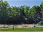 Miniature golf course by the basketball court at BARABOO RV RESORT BY RJOURNEY - thumbnail