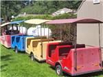 A colorful cart train at BARABOO RV RESORT BY RJOURNEY - thumbnail