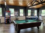 Table games and arcade games in the rec room at TERRE HAUTE CAMPGROUND - thumbnail