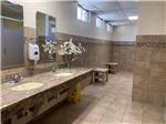 The inside of the clean restroom at FAYETTEVILLE RV RESORT & COTTAGES - thumbnail