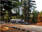 An empty gravel RV site at LAKE GEORGE RIVERVIEW CAMPGROUND - thumbnail