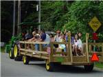 People riding on a tractor at LAKE GEORGE CAMPING VILLAGE - thumbnail