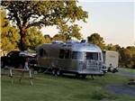 Airstream parked at campsite at FORT SMITH-ALMA RV PARK - thumbnail
