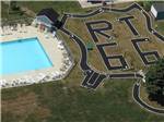 An aerial view of the swimming pool and track at DOUBLE J CAMPGROUND - thumbnail