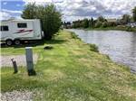 Back in gravel RV sites by the river at DEER LODGE A-OK CAMPGROUND - thumbnail