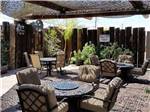 A covered outdoor seating area awaits you at HITCHIN' POST RV PARK - thumbnail