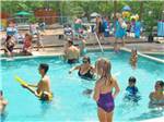 People cooling off at the onsite pool at ATLANTIC SHORE PINES CAMPGROUND - thumbnail