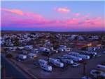 High level view of campground with beautiful pink sky at FOUNTAIN OF YOUTH SPA RV RESORT - thumbnail