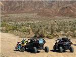 Two ATVS and a dirt bike riding in the mountains at FOUNTAIN OF YOUTH SPA RV RESORT - thumbnail