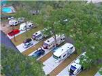 Aerial view of RV parked in paved sites at I-10 KAMPGROUND - thumbnail