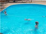Kids swimming in pool at I-10 KAMPGROUND - thumbnail