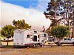 A fifth wheel trailer parked in a gravel site at CASINI RANCH FAMILY CAMPGROUND - thumbnail