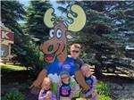 Kids standing around a cut out of a moose at STONEY CREEK RV RESORT - thumbnail