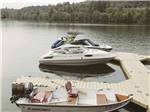 Boats parked at the dock at HARMONY LAKESIDE RV PARK & DELUXE CABINS - thumbnail