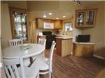 The kitchen area in the rental cabin at HARMONY LAKESIDE RV PARK & DELUXE CABINS - thumbnail