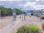 The gate leading into the pet area at CARAVAN OASIS RV RESORT - thumbnail