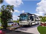 A luxury motorhome in a paved RV site at YACHT HAVEN PARK & MARINA - thumbnail