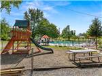 The playground next to the swimming pool at MOUNTAINEER CAMPGROUND - thumbnail
