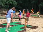 People enjoying miniature golf at CHRISTOPHER RUN CAMPGROUND - thumbnail