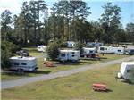 Trailers camping on grass at LAKE CITY CAMPGROUND - thumbnail