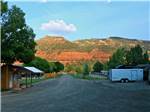 Looking down the gravel road at ALPEN ROSE RV PARK - thumbnail