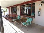 Chairs and picnic tables under the front office awning at SAN PEDRO RESORT COMMUNITY - thumbnail