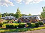 Trailers camping with people outside on sunny day at O'CONNELL'S RV CAMPGROUND - thumbnail