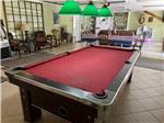 A red pool table in the rec room at TALLAHASSEE EAST CAMPGROUND - thumbnail