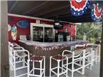 The bar area decorated for Fourth of July at SUGAR MILL RUINS TRAVEL PARK - thumbnail