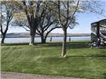 More grassy area with a view of the water at BOARDMAN MARINA & RV PARK - thumbnail
