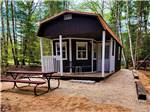 One of the cabin rentals with a fire pit at BIG CEDAR CAMPGROUND & CANOE LIVERY - thumbnail