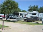 Class A motorhome hooked up in site at TRADERS VILLAGE RV PARK - thumbnail