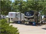 Two fifth wheels parked in sites at TRADERS VILLAGE RV PARK - thumbnail