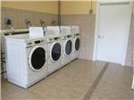 Laundry room with washer and dryers at THE DEPOT TRAVEL PARK - thumbnail
