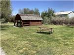 A picnic table in a grassy area at BEAVERHEAD RIVER RV PARK & CAMPGROUND - thumbnail