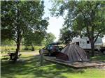 A tent pitched up in a gravel spot at BADLANDS / WHITE RIVER KOA HOLIDAY - thumbnail
