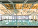 Indoor pool with translucent ceiling tiles at HOLIDAY RV VILLAGE - thumbnail