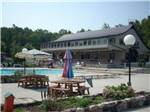 Pool area with picnic tables at ROUND TOP CAMPGROUND - thumbnail