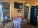 The kitchen area and bunk beds in the cabin at MADISON CAMPGROUND - thumbnail