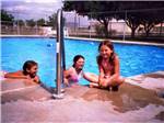 Children swimming in pool at MIDLAND/ODESSA RV PARK - thumbnail
