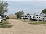A gravel road leading to RV spots BADLANDS MOTEL & CAMPGROUND - thumbnail