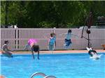 Kids swimming in pool at CAMP BELL CAMPGROUND - thumbnail