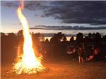 People around a large bonfire at BEAVER MEADOW FAMILY CAMPGROUND - thumbnail