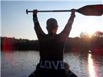 A woman with a shirt on that says LOVE kayaking at OTTER LAKE CAMP RESORT - thumbnail