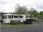 A motorhome in an RV site at ROGUE VALLEY OVERNITERS - thumbnail